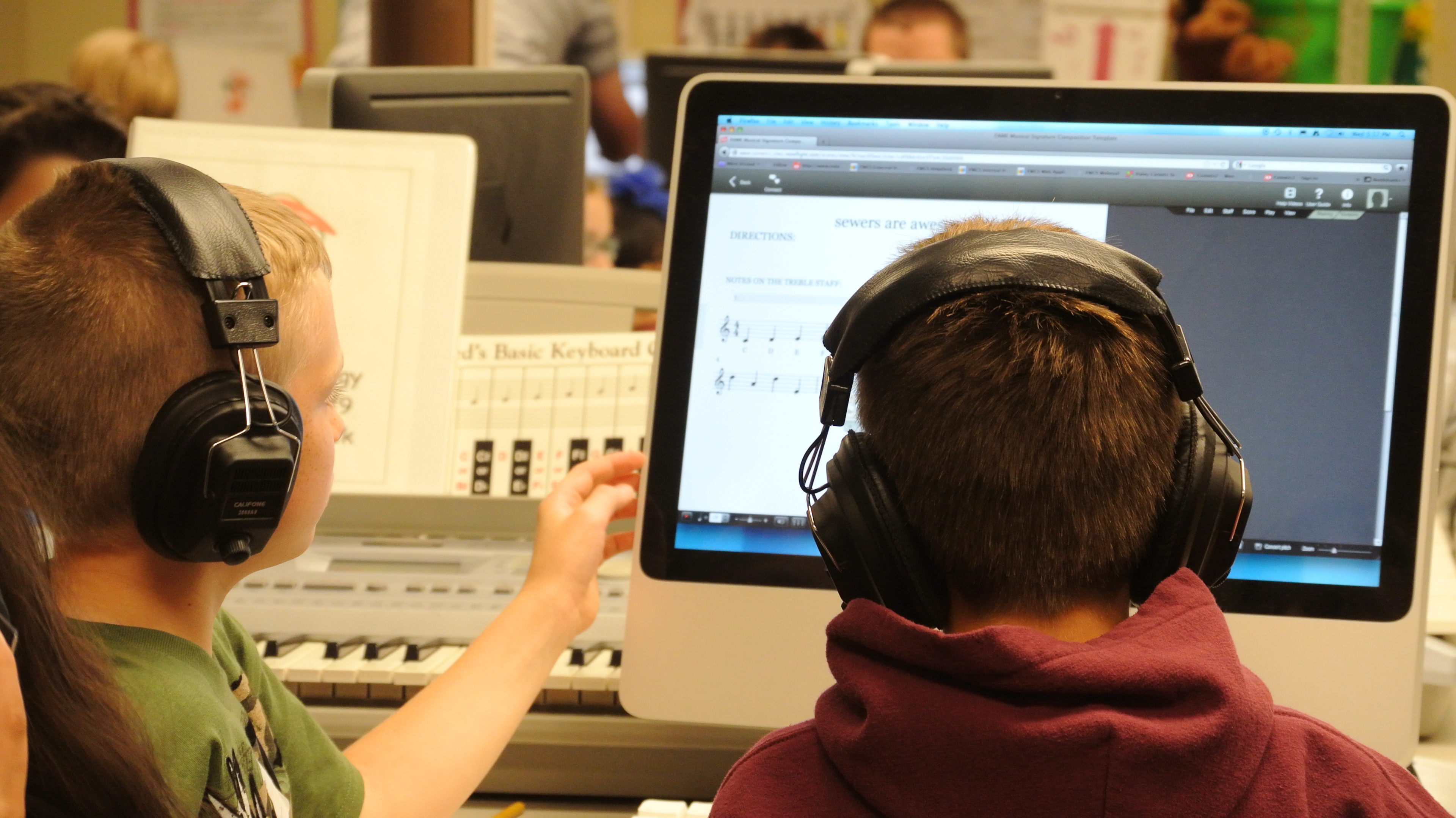 Students Writing Music On Computers For The FAME Composition Project